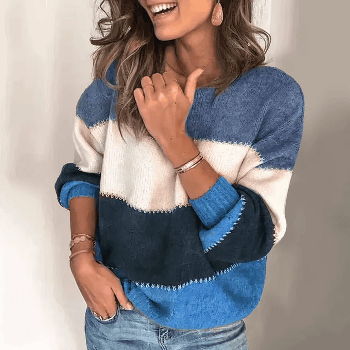 Soft women's relaxed fit knit sweater with classic crew neck and comfortable ribbed cuffs for effortless style.