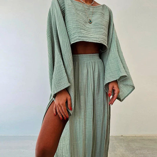 Women's relaxed fit linen blend two-piece set with a cropped top & slit skirt, perfect for summer wear.