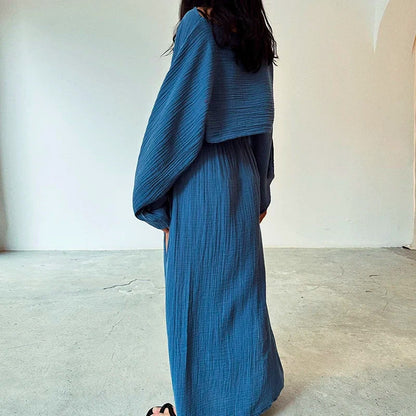 Comfortable women's linen blend two-piece summer set, including a breezy cropped top and an elegant slit skirt.