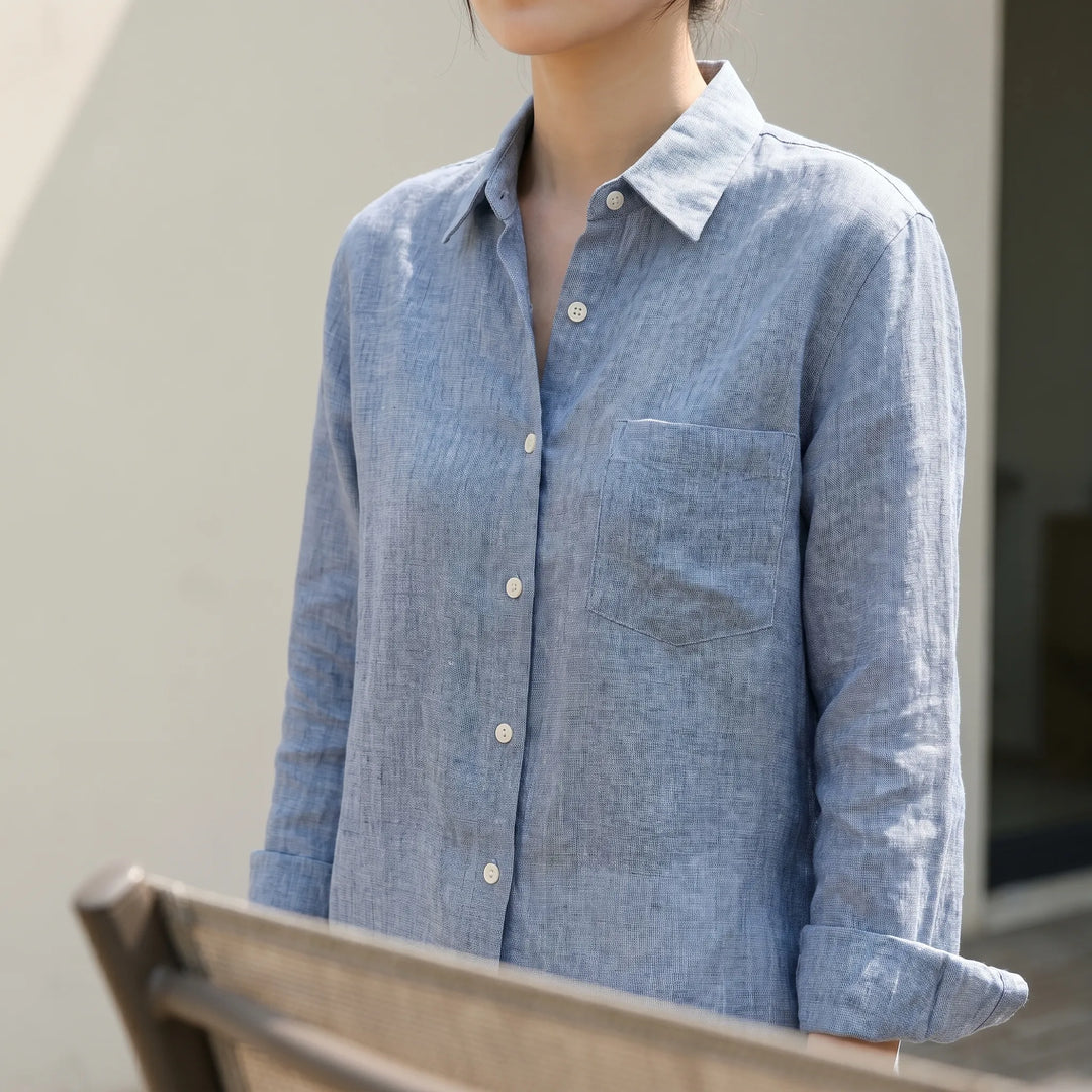 Women's relaxed fit long sleeve button-up shirt in classic style for effortless everyday wear. Versatile casual top.