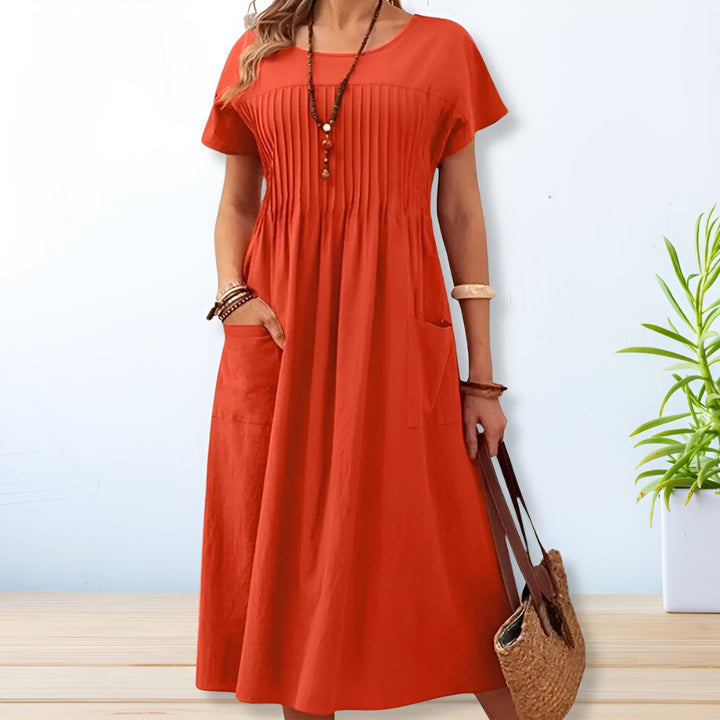 Versatile women's midi day dress, relaxed fit, short sleeve, perfect for casual summer wear with pockets.