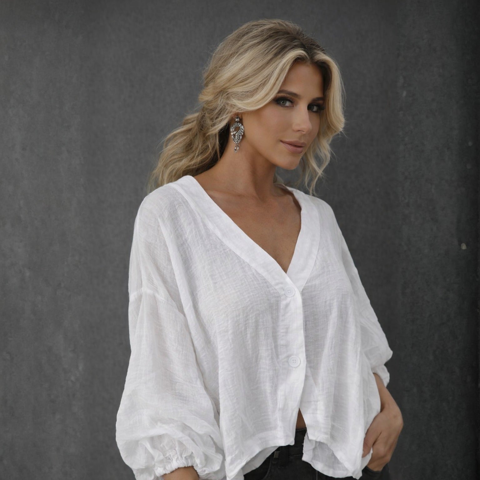 White relaxed fit summer blouse with batwing sleeves & button-down front. Casual & airy.