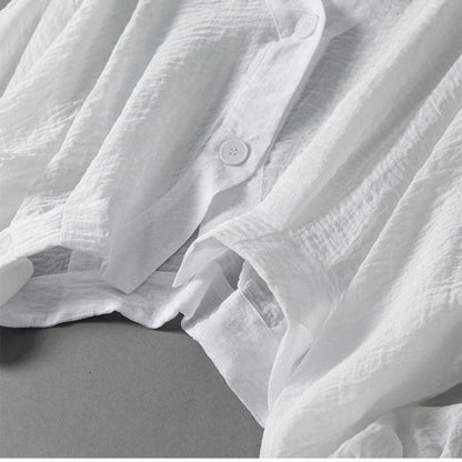 Everyday white relaxed fit button-down blouse for women. Airy summer top, comfortable & stylish.