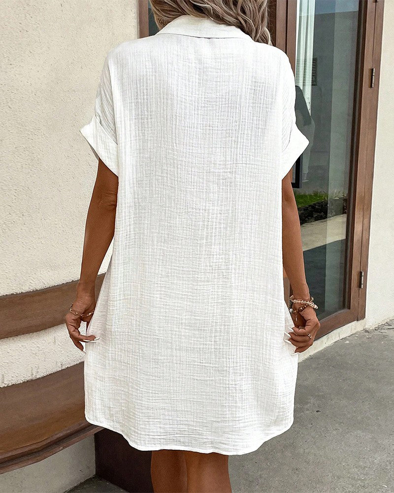 Women's relaxed summer dress in a flattering fit, available in white, black, or light blue for casual style.