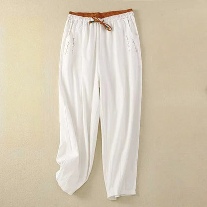 Women's relaxed fit summer trousers, ideal for stylish comfort. Features wide-leg design, high waist for everyday fashion.