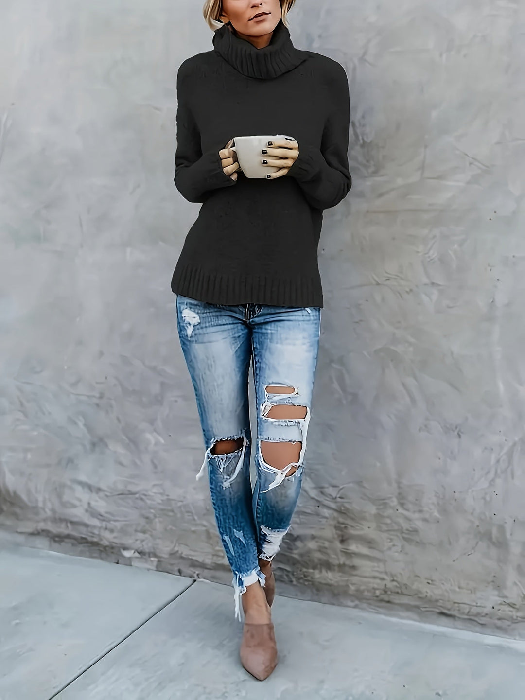 Stylish women's relaxed fit turtleneck sweater with split hem. Cozy knitwear for modern fall apparel.