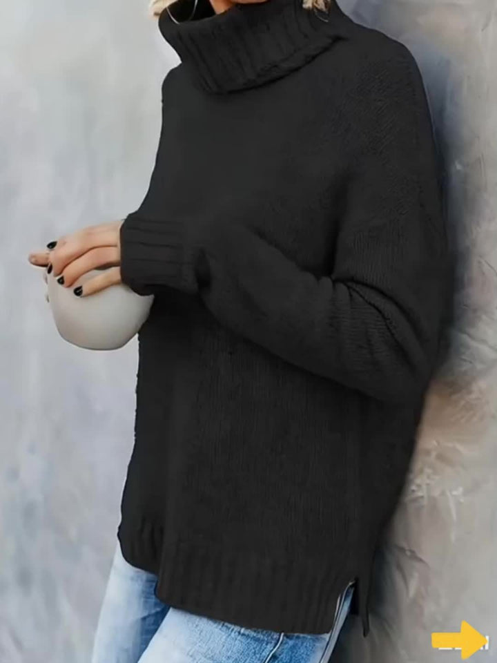 Women's relaxed fit turtleneck sweater with split hem. Cozy long sleeve pullover for casual wear.