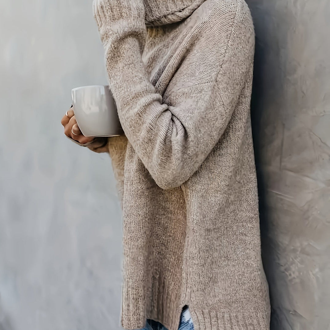 Modern women's relaxed fit turtleneck sweater with a stylish split hem. Cozy long sleeve pullover for fall fashion.