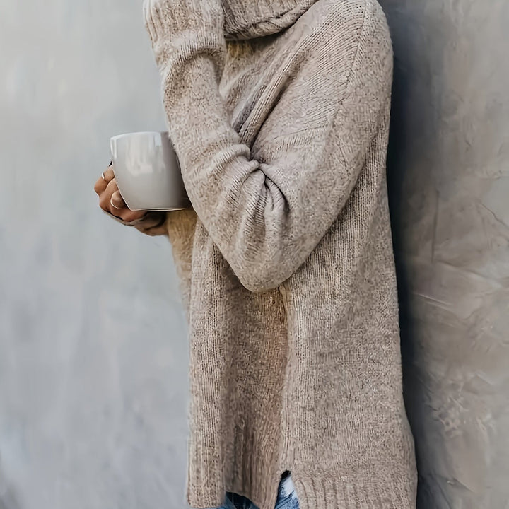 Modern women's relaxed fit turtleneck sweater with a stylish split hem. Cozy long sleeve pullover for fall fashion.