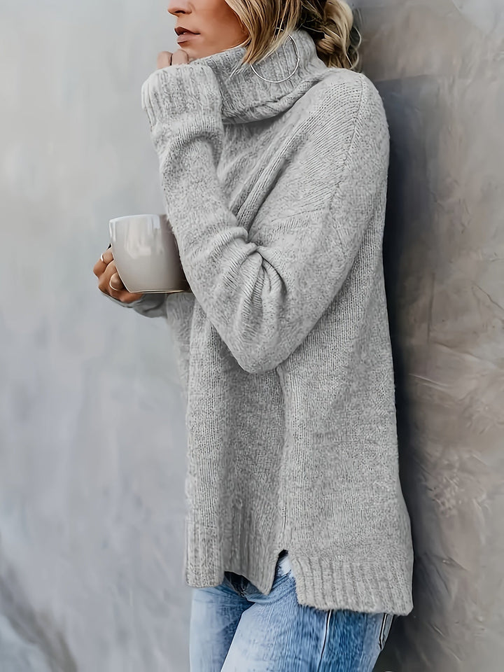 Cozy knit women's pullover sweater, relaxed turtleneck, long sleeve with split hem. Ideal for fall.