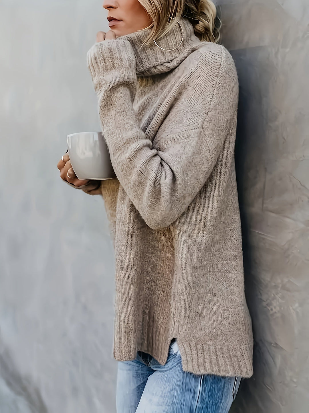 Everyday comfort: relaxed fit women's turtleneck sweater with a stylish split hem for winter style.