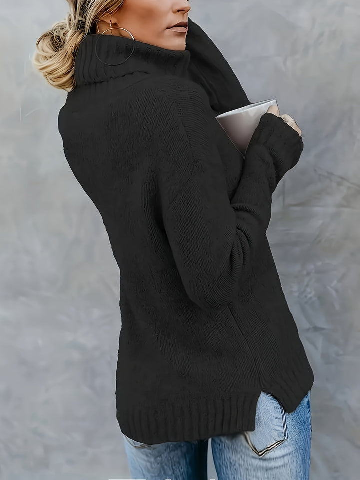 Long sleeve women's turtleneck sweater featuring a relaxed fit & fashionable split hem. Fall/winter apparel.
