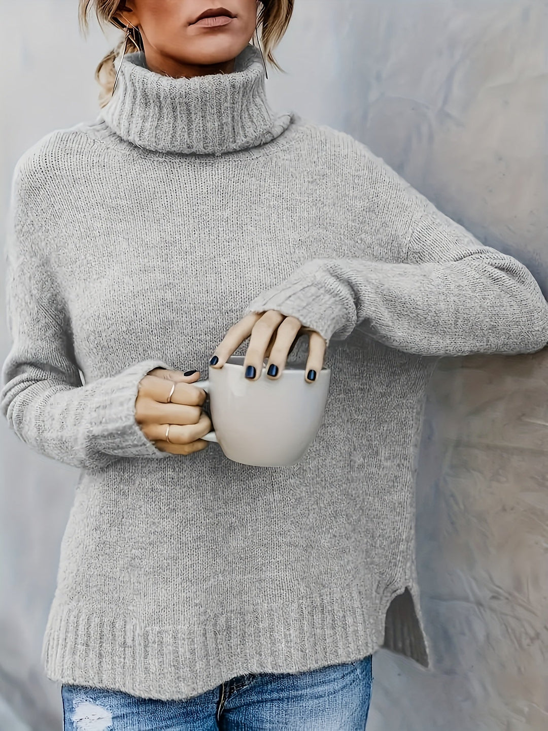 Women's pullover turtleneck sweater, cozy relaxed fit, with a trendy split hem. Great for casual comfort.