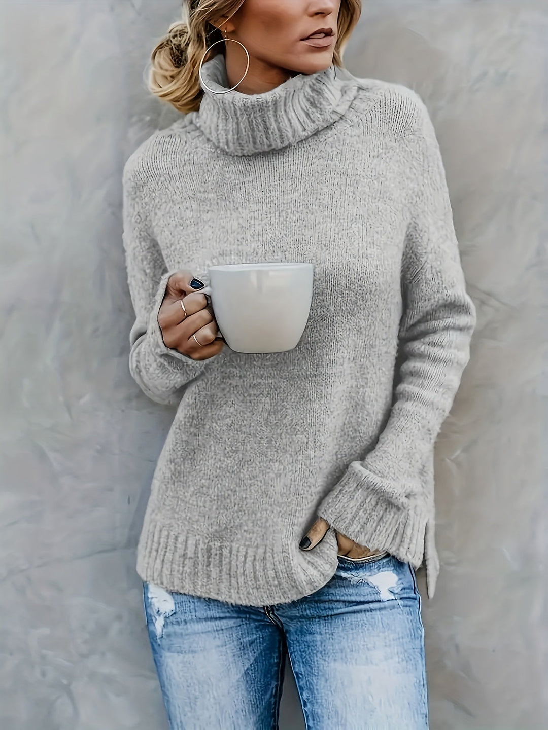 Relaxed fit women's turtleneck sweater, cozy long sleeve pullover with a stylish split hem for fall/winter.