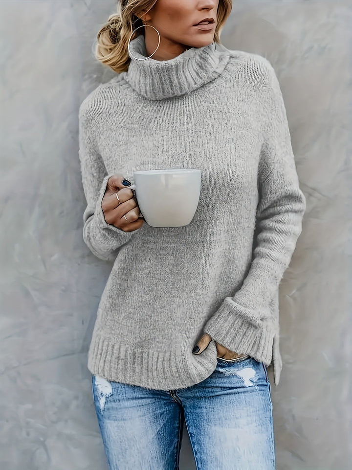 Relaxed fit women's turtleneck sweater, cozy long sleeve pullover with a stylish split hem for fall/winter.