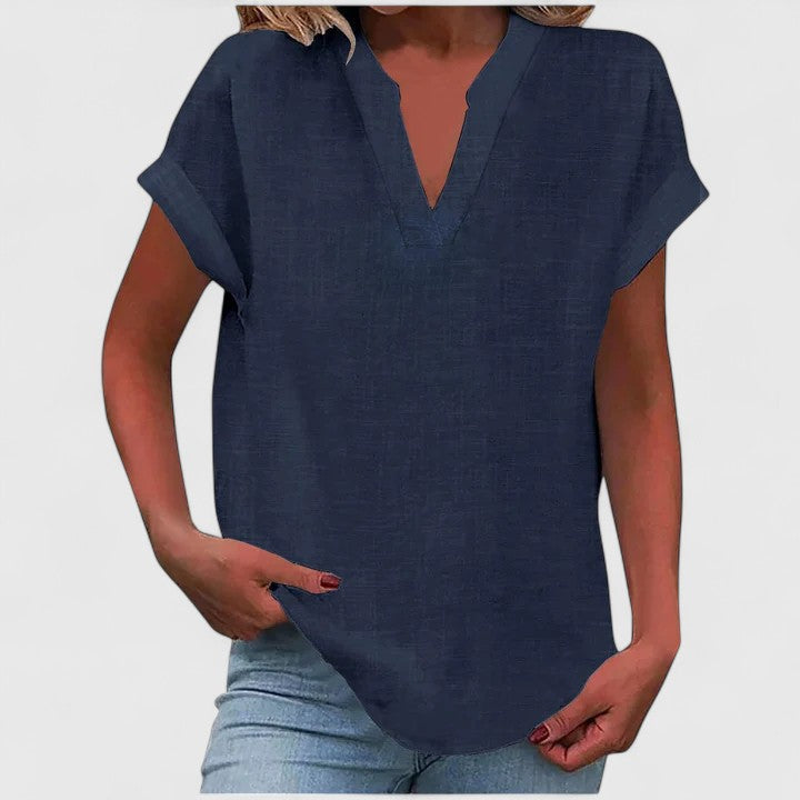 Professional yet casual V-neck blouse for women, loose fit for work or leisure, with cap sleeves.