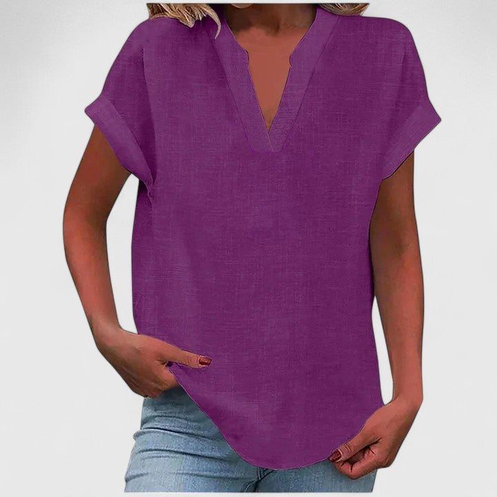 Chic casual V-neck top for women with a loose fit and cap sleeves, perfect for spring/summer fashion.