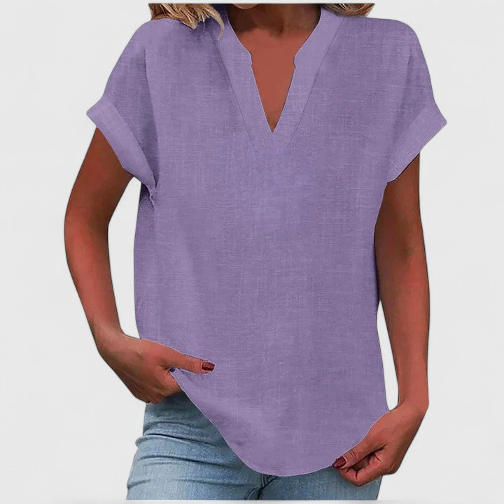 Relaxed fit women's blouse, a comfortable V-neck top with a chic curved hem for any season.