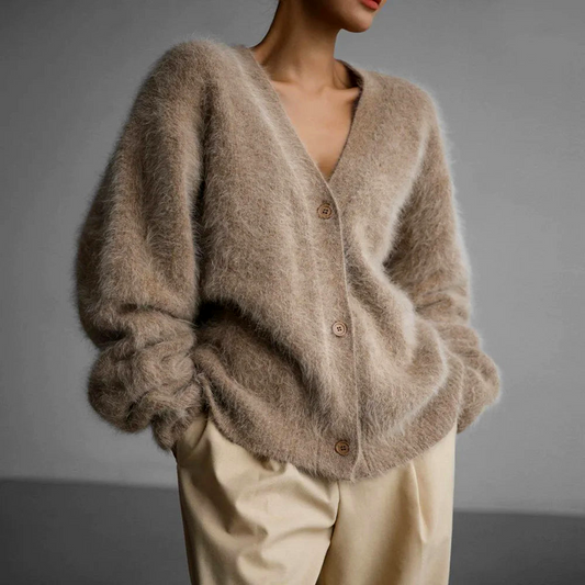 Women's relaxed fit V-neck button cardigan in a cozy knit, perfect for stylish fall and winter layering.