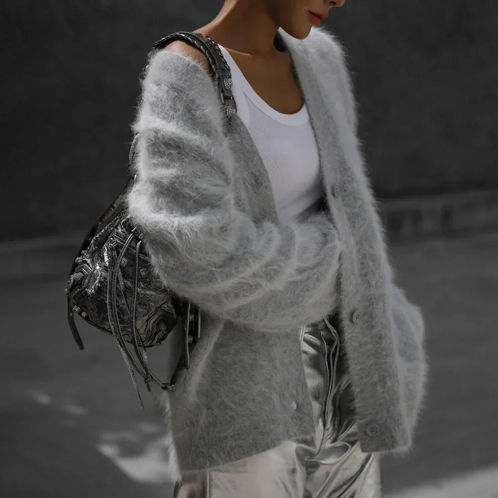 Chic women's relaxed fit V-neck cardigan sweater with functional buttons, a stylish wardrobe essential.