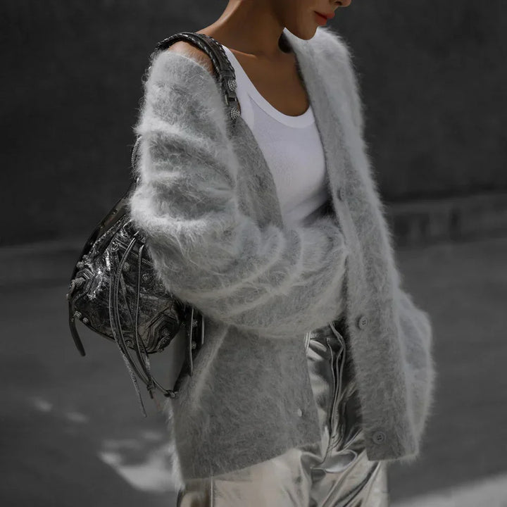 Chic women's relaxed fit V-neck cardigan sweater with functional buttons, a stylish wardrobe essential.