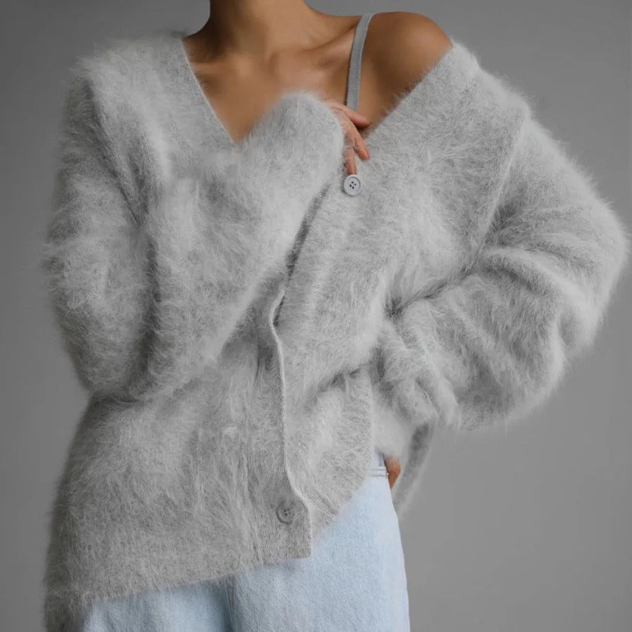 Stylish women's relaxed V-neck button cardigan for fall, a comfortable and warm winter layering sweater.