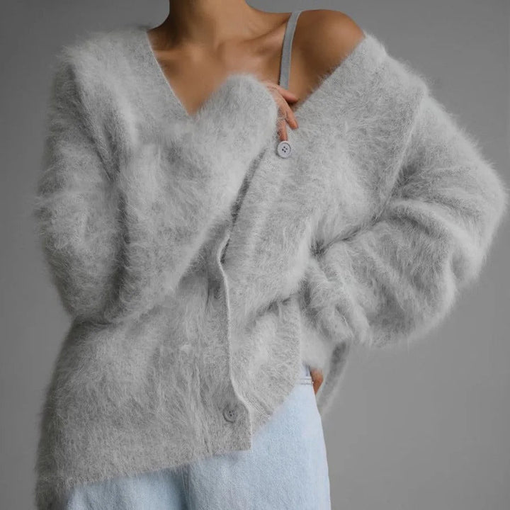Stylish women's relaxed V-neck button cardigan for fall, a comfortable and warm winter layering sweater.