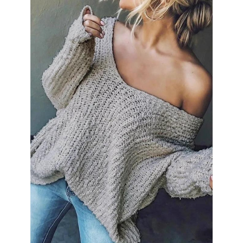 Stylish women's relaxed V-neck knit sweater, ideal for fall fashion or spring style. Comfortable drop shoulder.