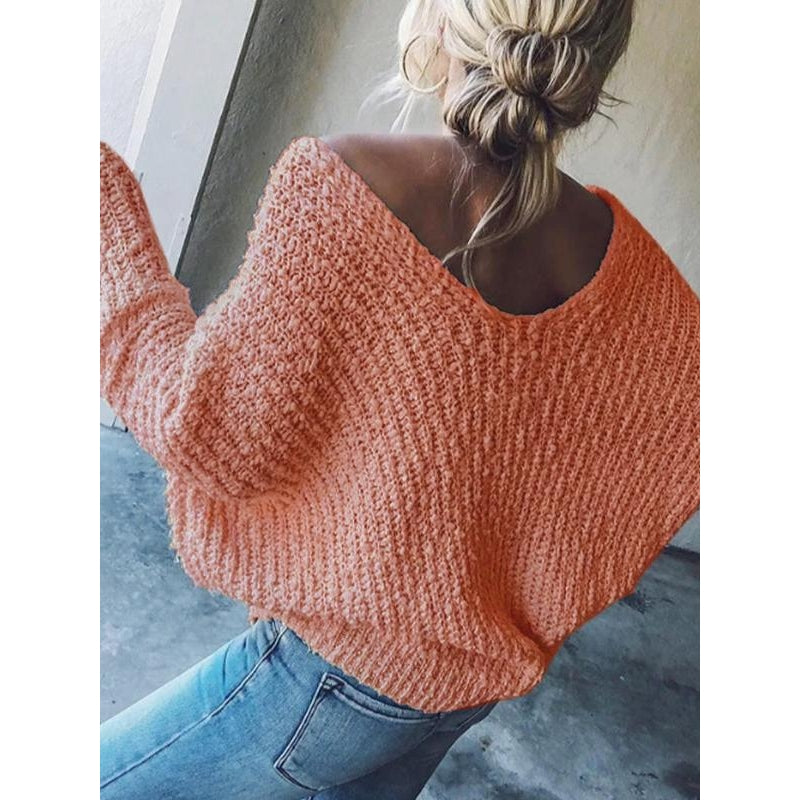Women's relaxed V-neck knit sweater with drop shoulder. Comfortable, versatile, and chic for fall/spring fashion.