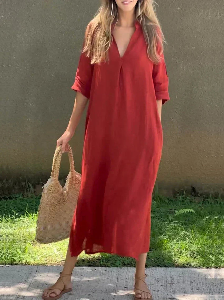 Women's V-neck maxi dress with a relaxed fit and side slit, a must-have for summer vacation fashion.