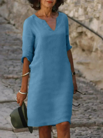 Effortless women's relaxed fit V-neck dress, short sleeve midi with pockets, great for summer fashion.