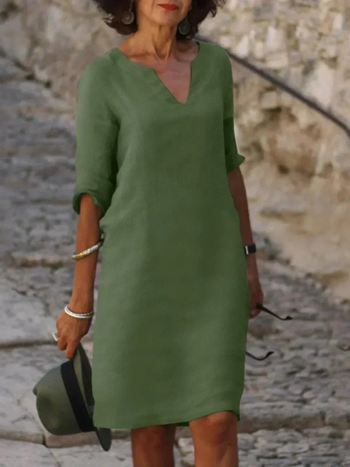 Stylish women's V-neck casual midi dress, relaxed fit, short sleeve, perfect for summer everyday fashion.