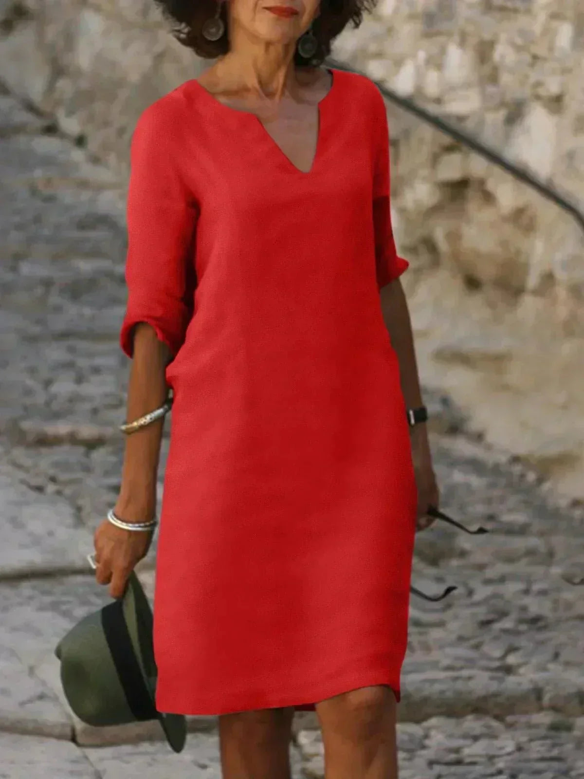 Flowy women's V-neck summer dress, relaxed fit, short sleeve midi with pockets for ultimate comfort.