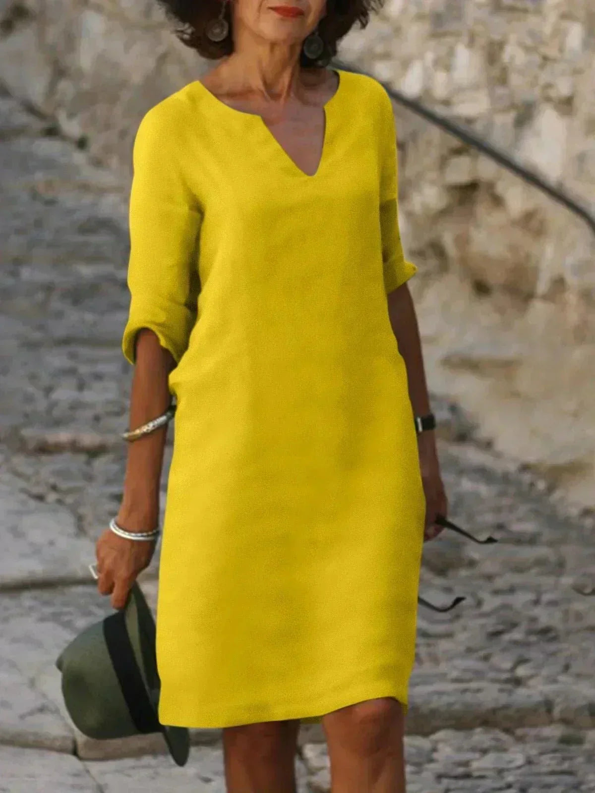 Soft women's relaxed V-neck midi dress, short sleeve with pockets, perfect for everyday casual wear.
