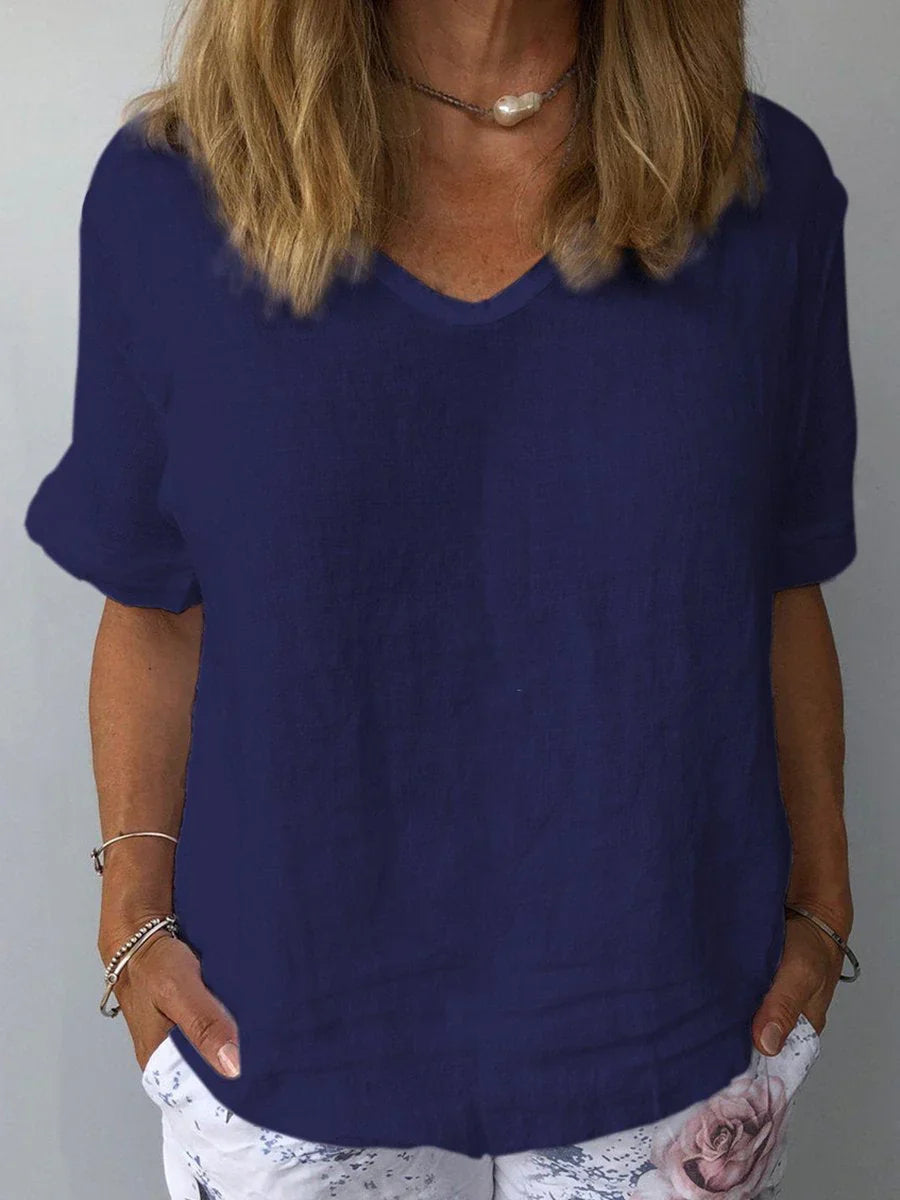 Women's relaxed fit V-neck short sleeve blouse for casual everyday comfort and style. Perfect summer top.