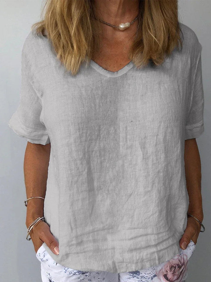 Casual women's relaxed fit V-neck short sleeve blouse. Everyday comfort top, perfect for summer.