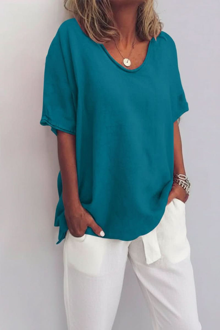 Women's relaxed V-neck summer blouse, showcasing its comfortable fit and effortless casual everyday style.