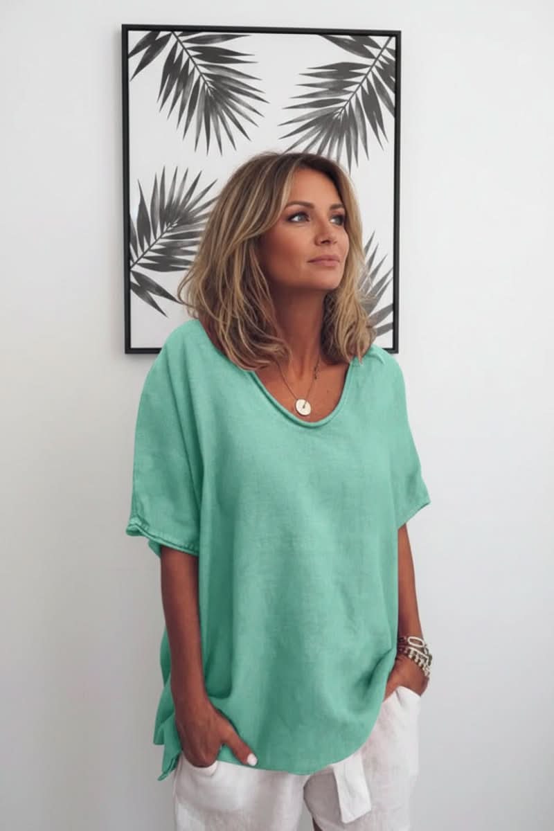 Dark pink women's V-neck summer blouse. Relaxed fit for effortless style and comfortable casual wear.