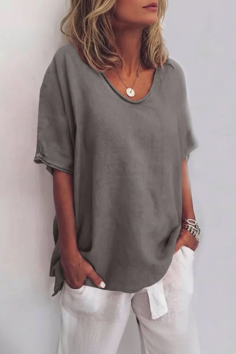 Green women's relaxed V-neck summer blouse. Effortless everyday top for casual warm weather fashion.