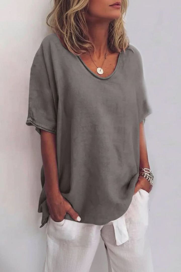 Green women's relaxed V-neck summer blouse. Effortless everyday top for casual warm weather fashion.