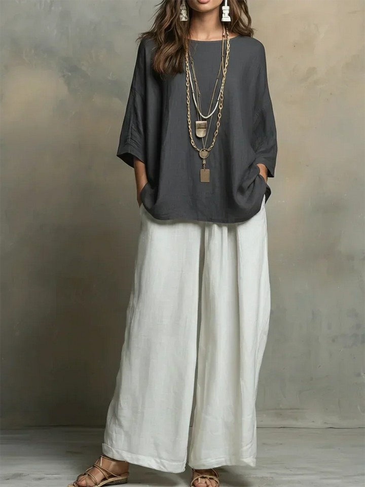 Comfortable black women's relaxed fit shirt and wide-leg pants set, a chic choice for casual or vacation wear.