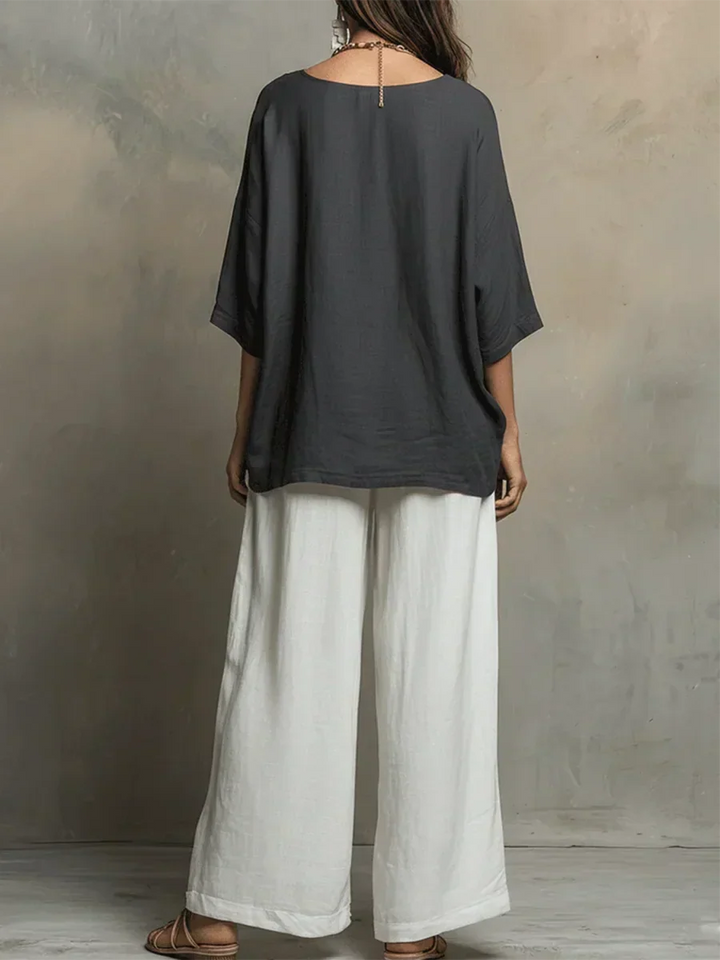 Chic women's relaxed fit shirt & wide-leg pants matching set. Comfortable, versatile two-piece for summer casual wear.