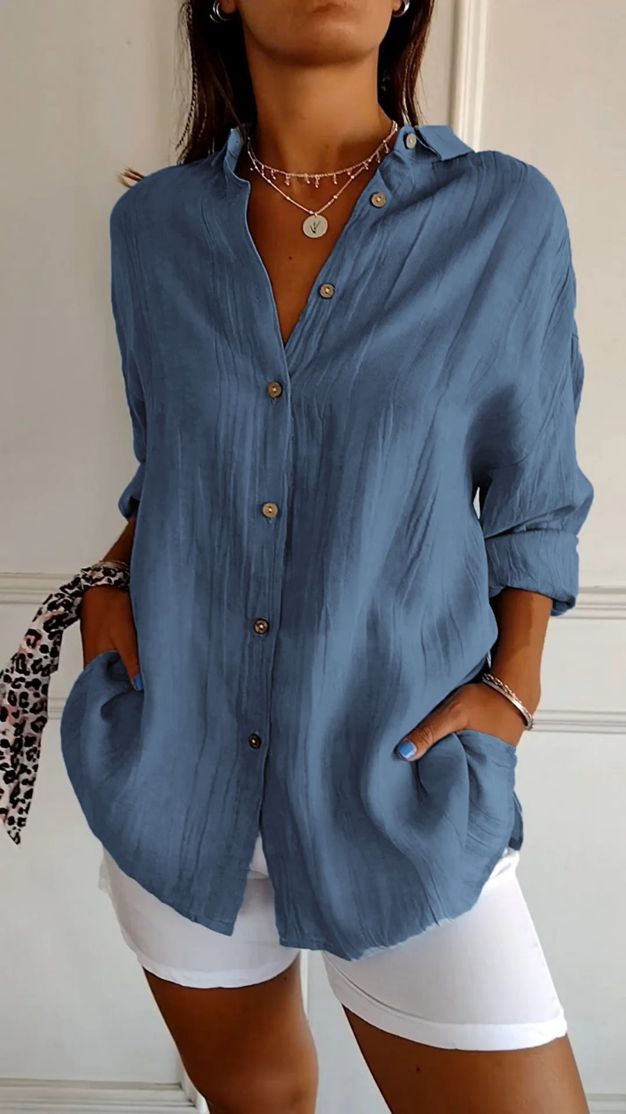 Soft fabric women's oversized long sleeve button-up shirt, relaxed fit, ideal for comfortable daily wear.