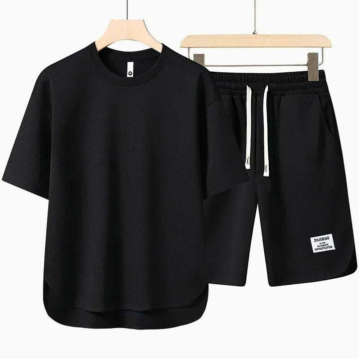 Oversized women's two-piece T-shirt and shorts set; ideal comfortable summer loungewear or vacation outfit.