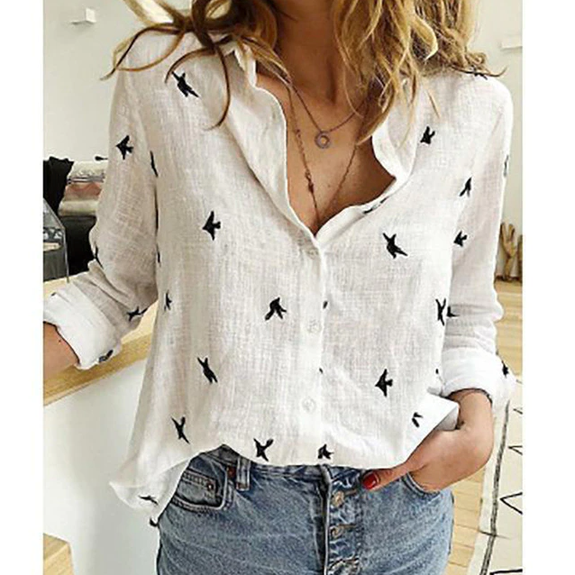 Elegant versatile women's blouse, relaxed fit, long sleeve, point collar for office style.
