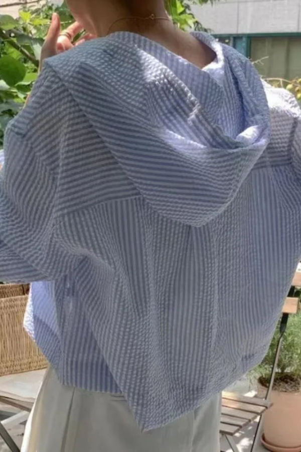Comfortable women's long sleeve hooded blouse. Relaxed summer top for effortless and casual wear.