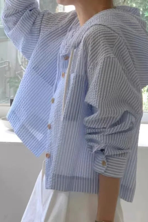 Women's casual hooded blouse. Relaxed fit long sleeve top for versatile summer style and comfort.