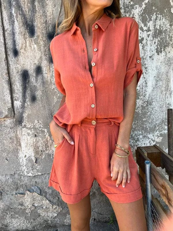 Woman models relaxed two-piece summer shorts & top set, perfect for warm weather and casual elegance.