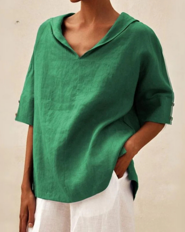 Women's relaxed V-neck blouse with short sleeves, perfect for casual everyday wear.