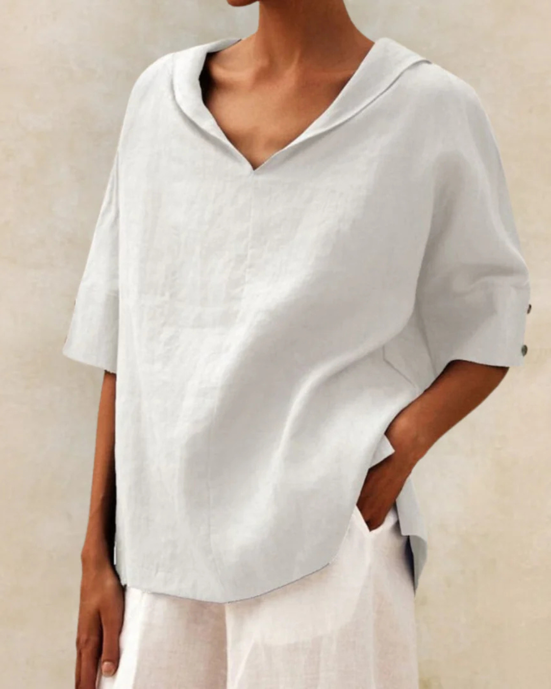 Versatile women's short sleeve V-neck top, a chic and relaxed fit blouse for casual and daily outfits.